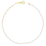 A dainty freshwater pearl anklet with 14k solid yellow gold chain and clasp.