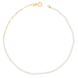 A dainty freshwater pearl anklet with 14k solid yellow gold chain and clasp.