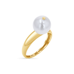 A large, round freshwater pearl set on a 14K solid gold band stamped with BG 14K.
