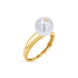 A large, round freshwater pearl set on a 14K solid gold band stamped with BG 14K.