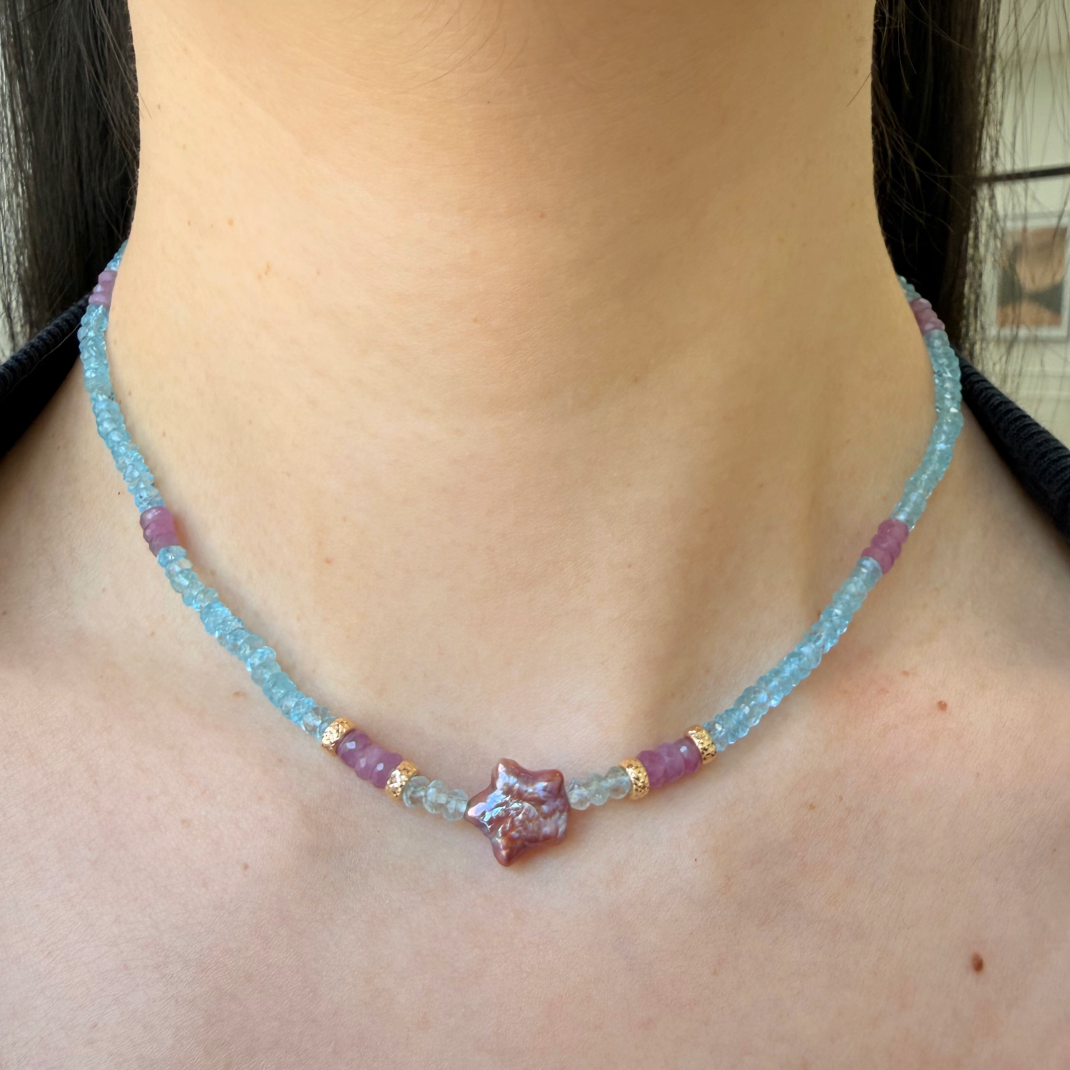 14K gold beads and clasp, aquamarine faceted beads, pink sapphire beads on model's neck.