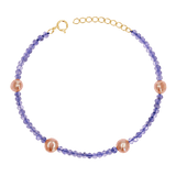 Gemstone and 14K gold bracelet with genuine tanzanite and station pink freshwater pearls. Includes solid gold spring lock and extender.