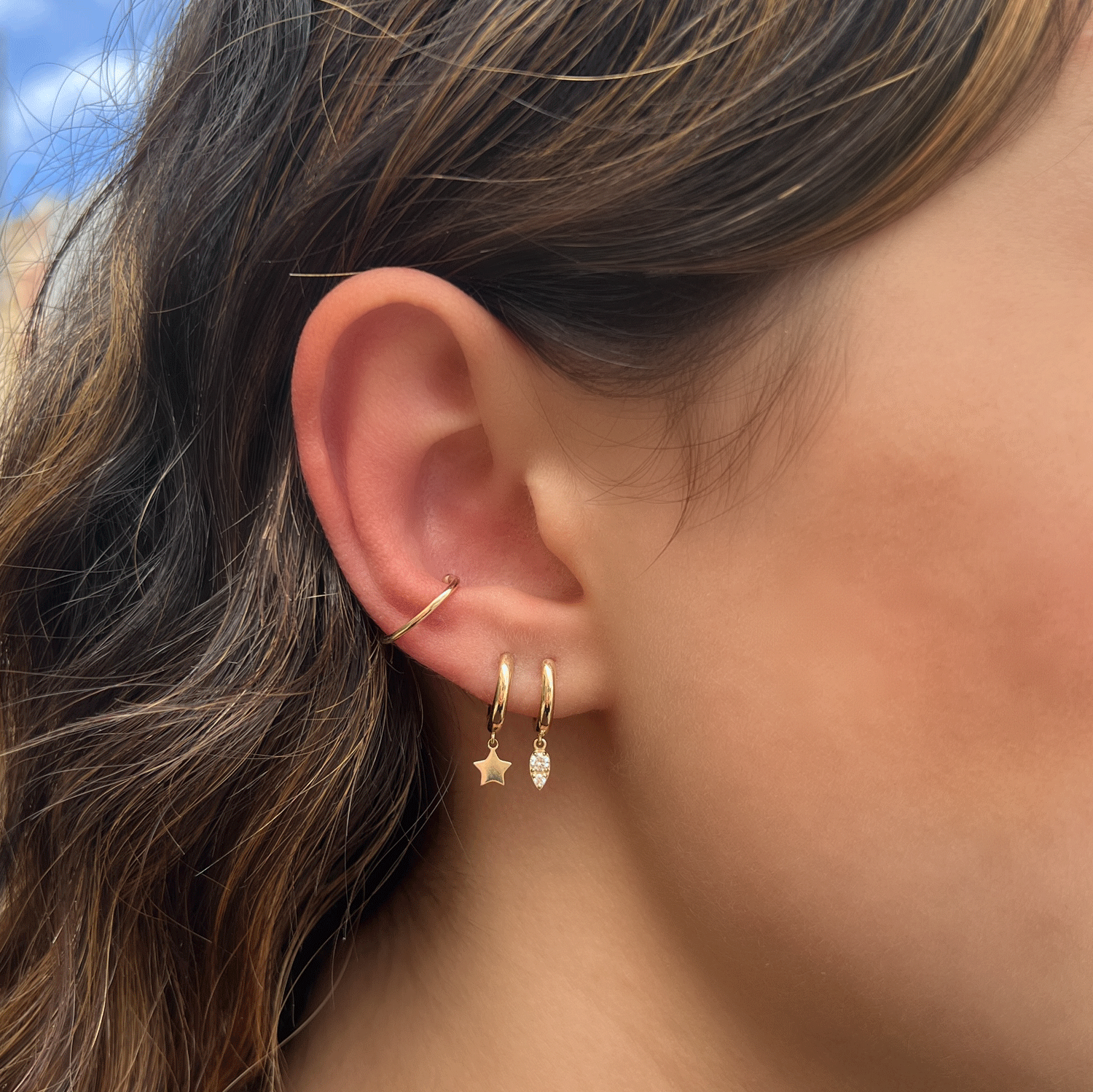 Solid gold huggie online earrings with charm